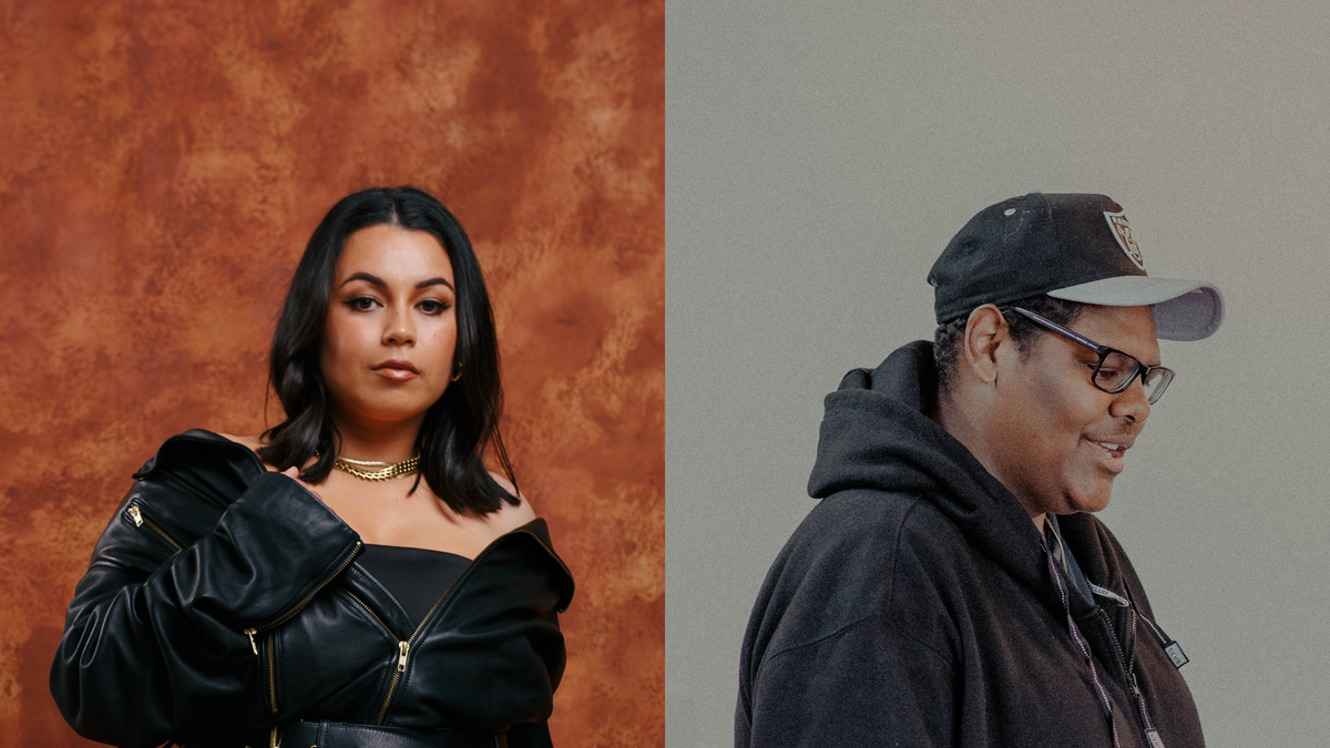 The image is split into two. On the left, a woman stands powerfully in front of an earthy brown, patterned wall. She looks directly at the camera with a strong, neutral expression. Her black, shiny skirt of her dress puffs outwards. The bodice of the dress is tighter and hidden underneath a black leather jacket, with gold zips. She also wears a black leather belt with gold belt holes. The jacket fits loosely and falls off the woman's shoulders, exposing a gold necklace around her neck. Her make-up is shiny and beautiful with glossy, long black hair. The man on the right stands in front of a plain grey background wearing a cap and sunglasses. He looks down with a serene smile on his face, and mouth slightly open as if he's singing.